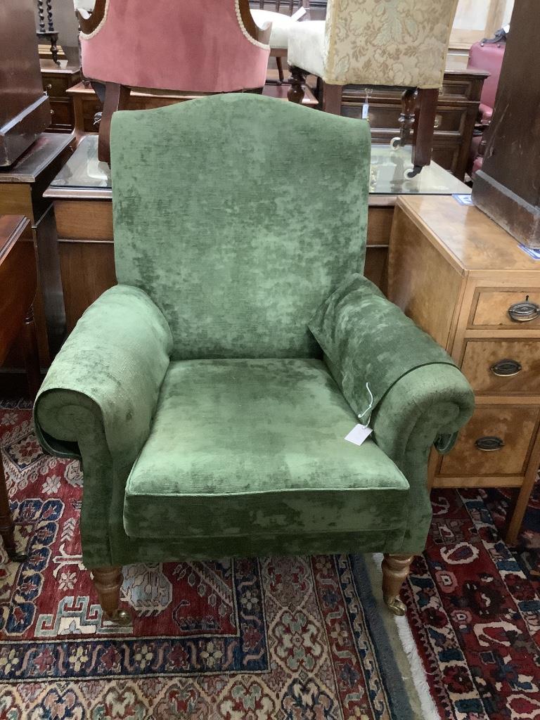 A Victorian style lounge armchair, with green upholstery, width 84cm, depth 74cm, height 96cm